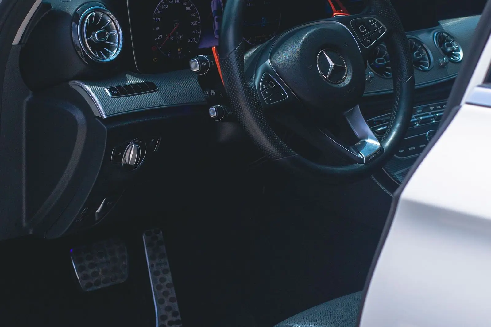 Steering wheel and pedal area