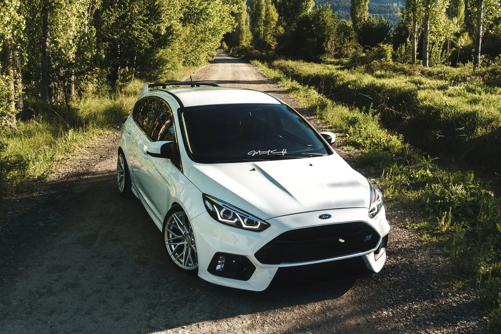 White hatchback seen from a high angle