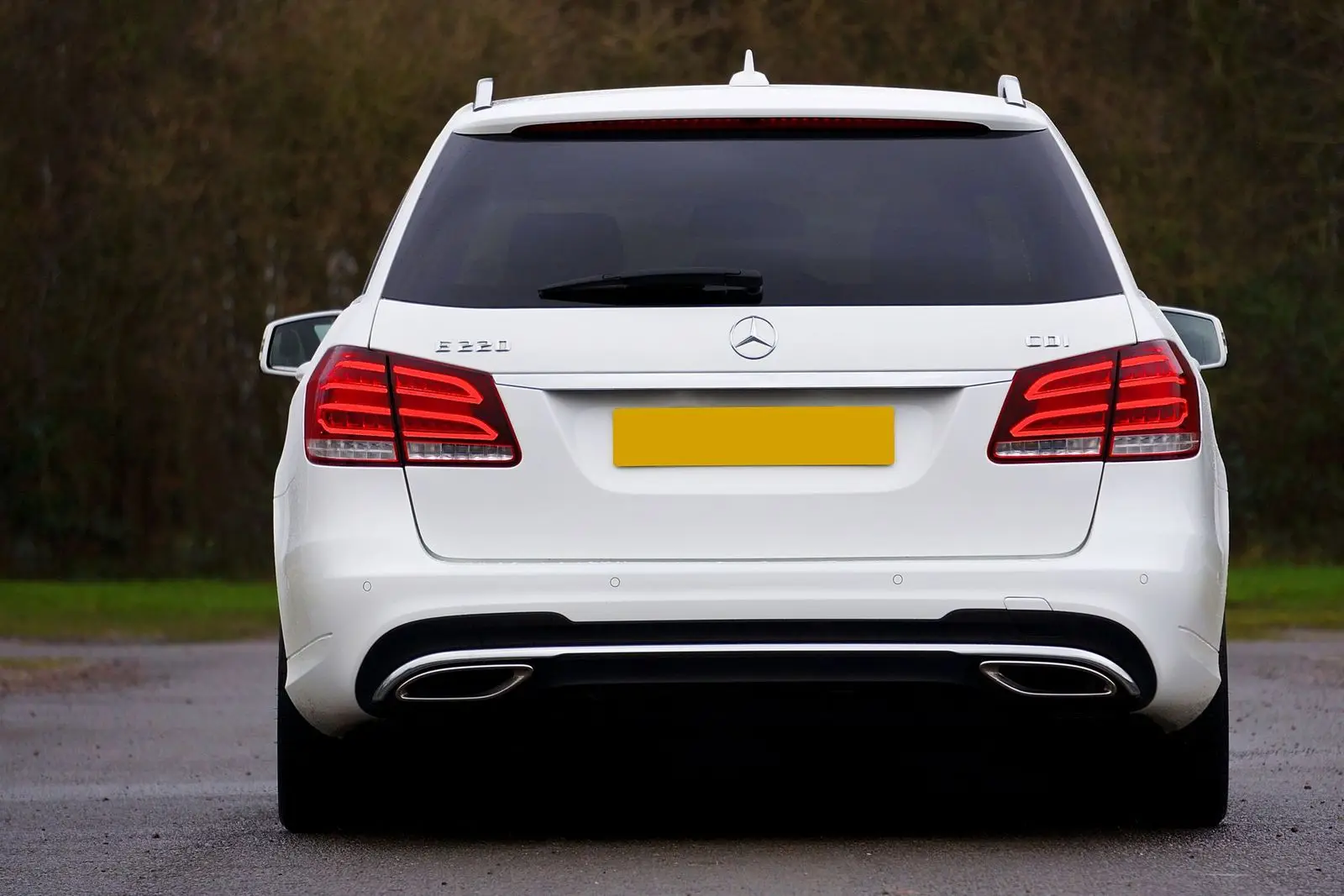 White station wagon, rear view