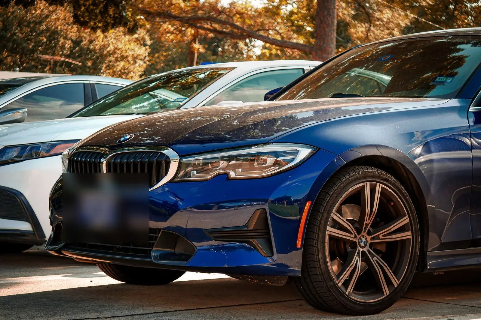 Dark blue BMW, front grille and wheel